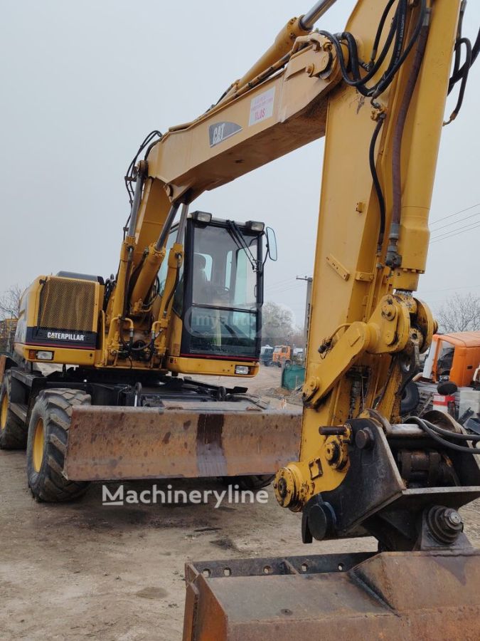 Caterpillar 120 / 120 AWD 2000 — photo 2