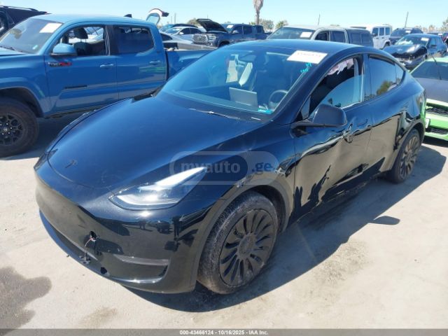 Tesla Model Y 2024 — photo 2
