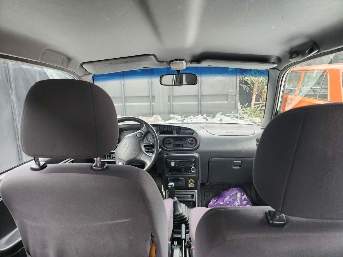 Daihatsu Cuore 2002 — photo 2