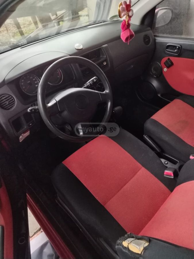 Daihatsu Cuore 2007 — photo 2