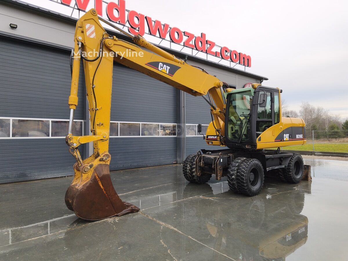 Caterpillar 120 / 120 AWD 2003 — photo 2