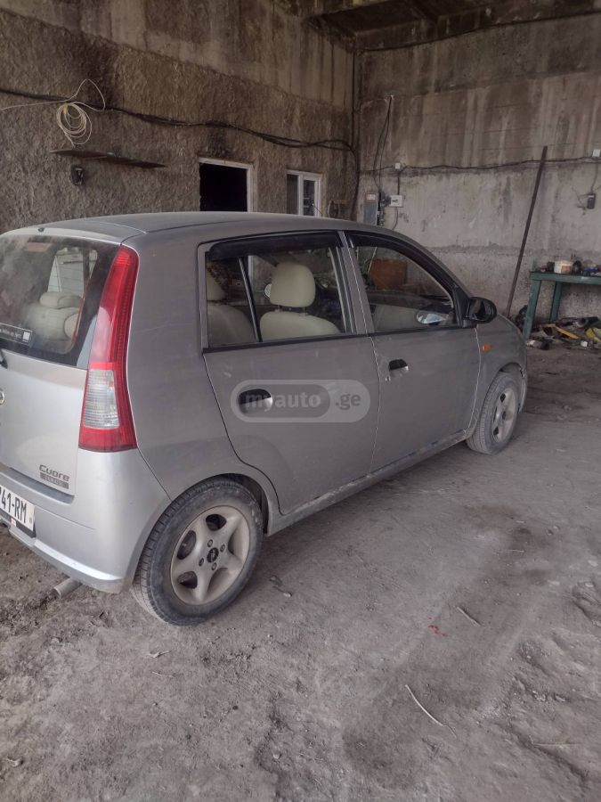 Daihatsu Cuore 2005 — photo 2