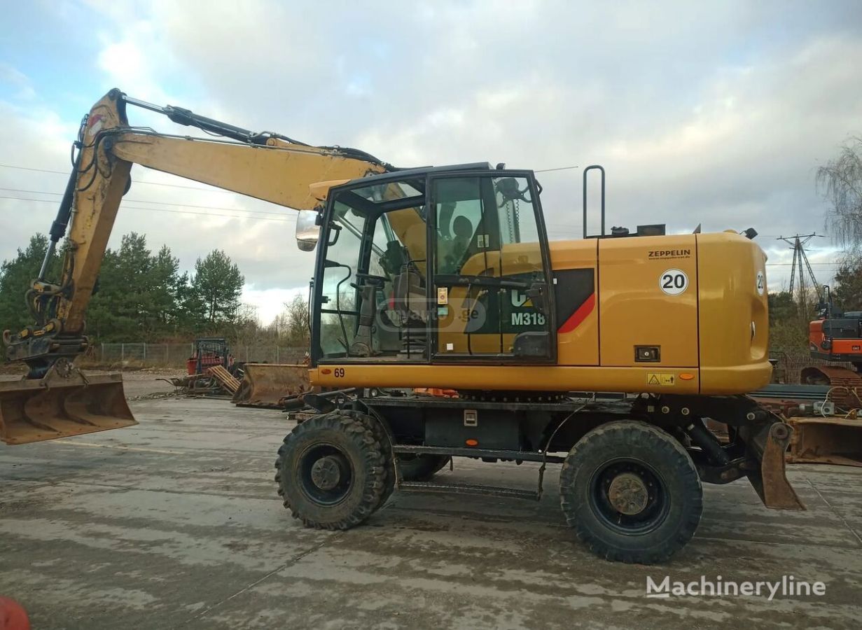 Caterpillar M318 2016 — photo 2