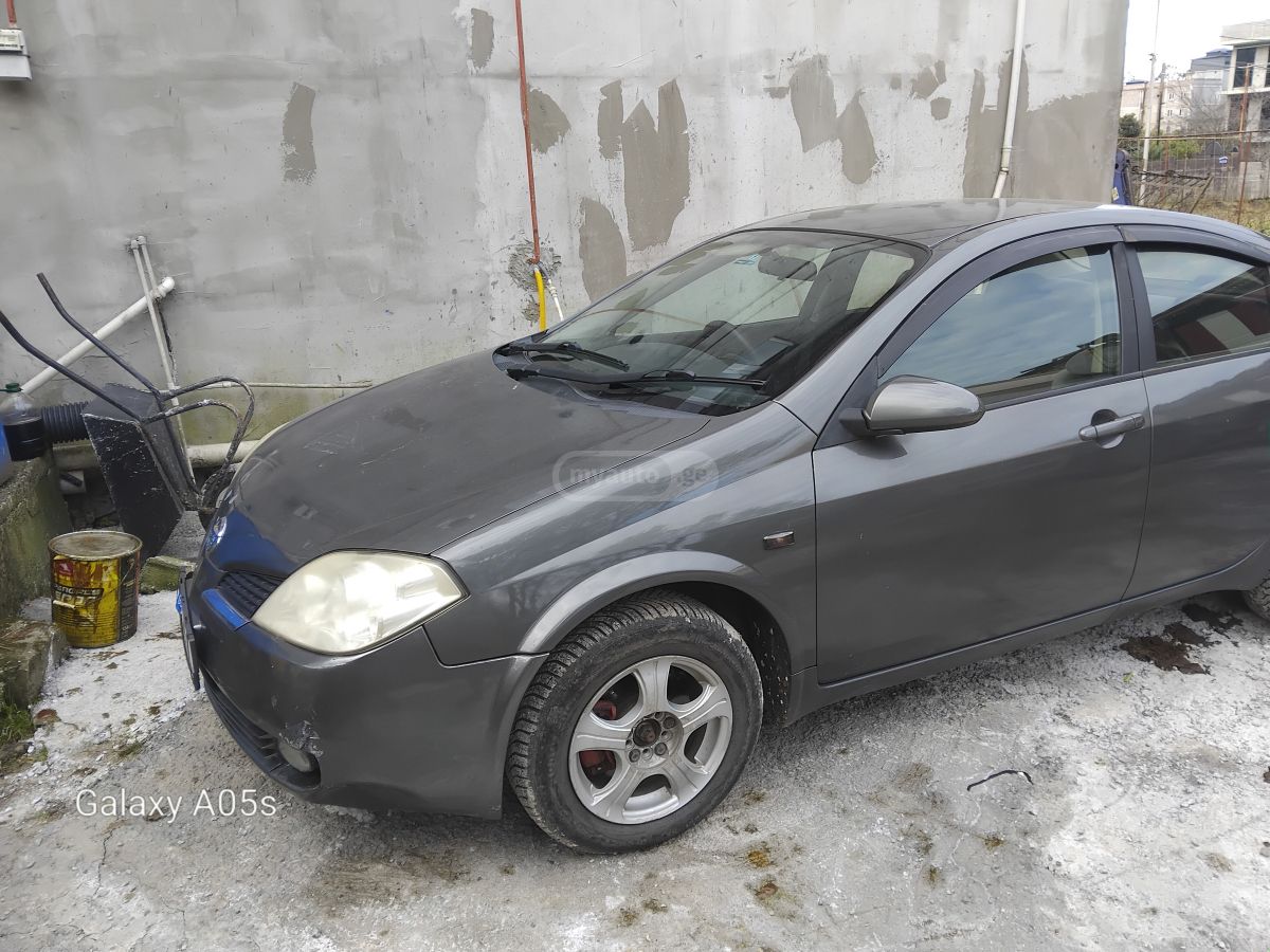 Nissan Primera 2004 — photo 2
