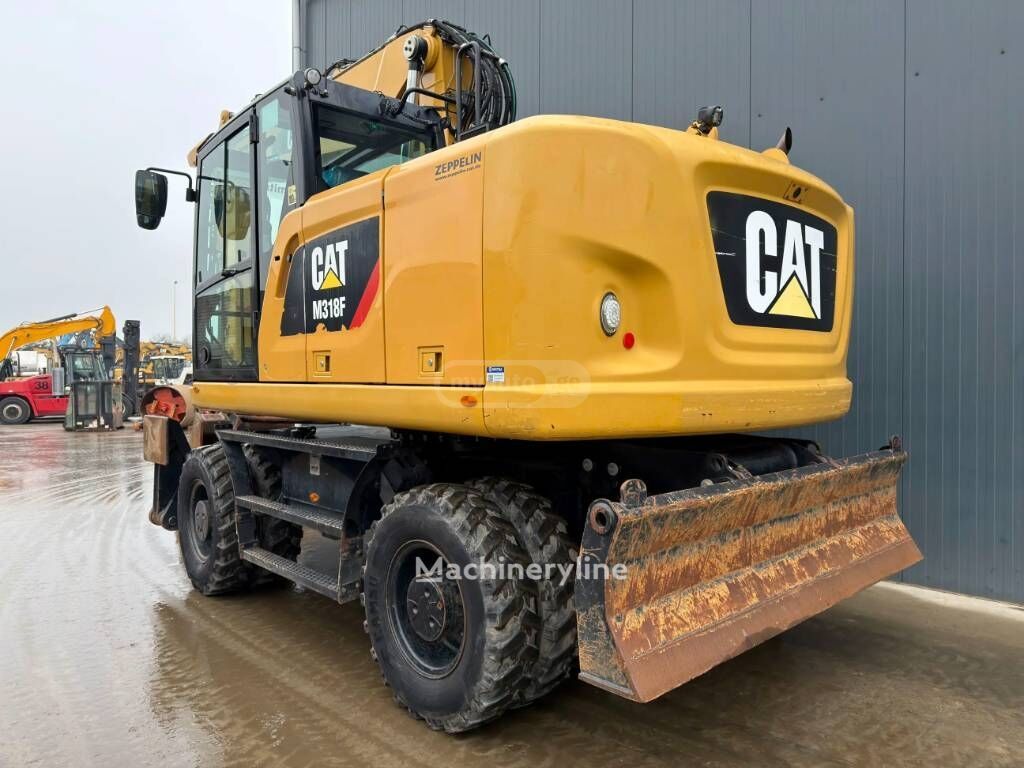 Caterpillar M318 2015 — photo 2
