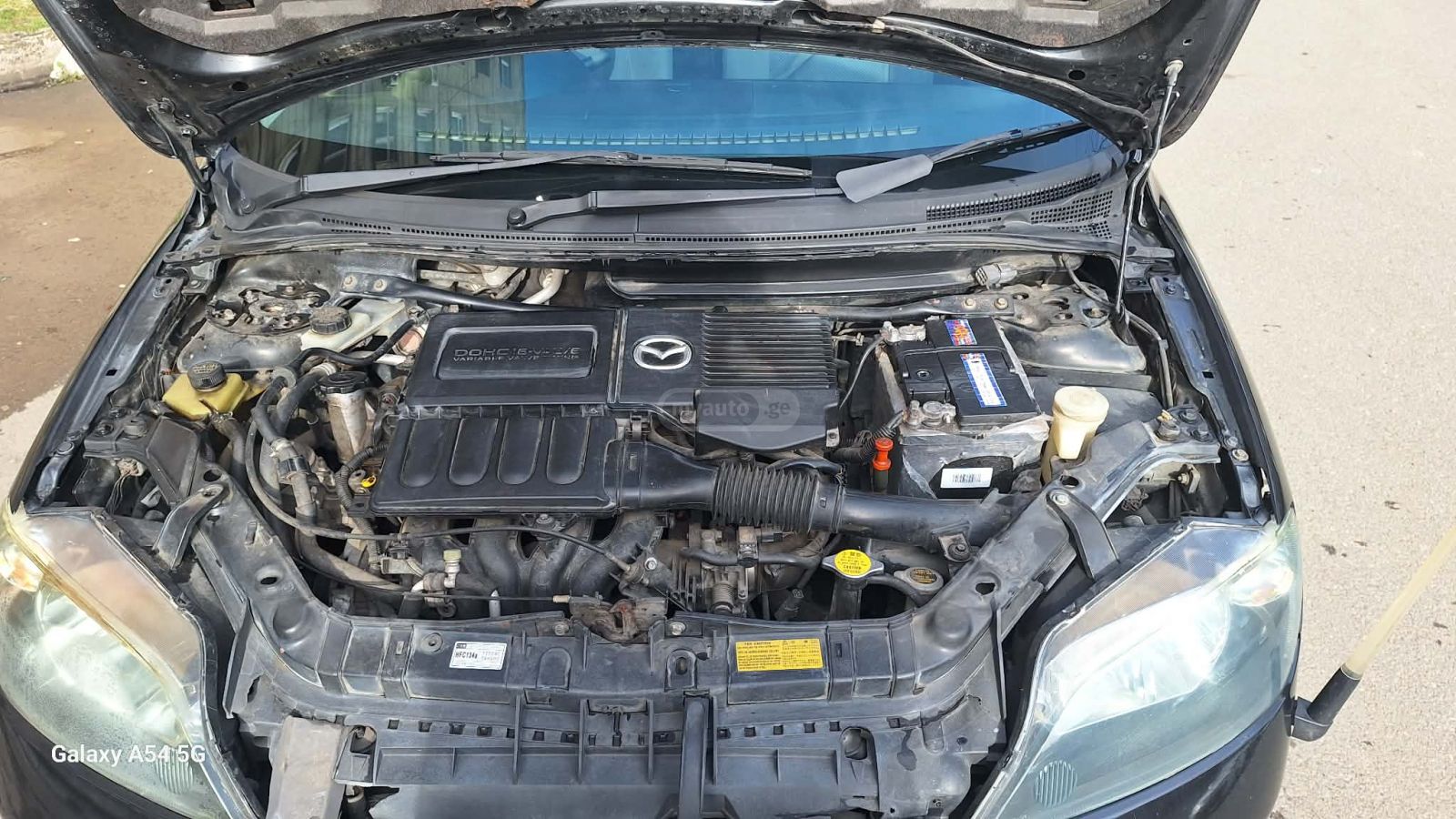 Mazda Demio 2002 — photo 2