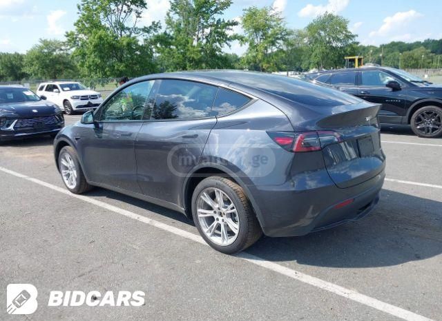 Tesla Model Y 2024 — photo 2