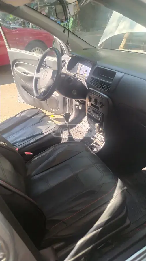 Daihatsu Cuore 2005 — photo 2