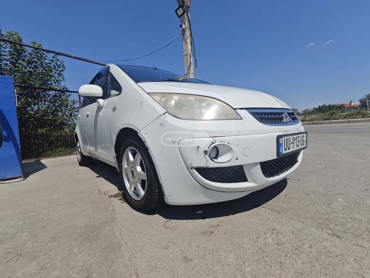 Mitsubishi Colt 2004 — photo 2
