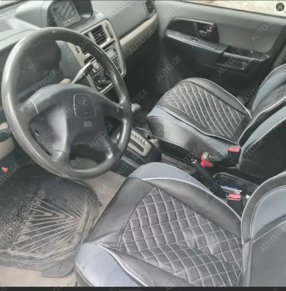 Mitsubishi Pajero-Io 1999 — photo 2