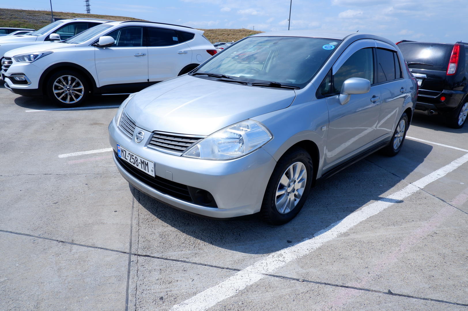 Nissan Tiida 2006 — photo 2